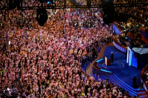 Bill Clinton walks onstage to an ovation of flag-waving supporters before praising Barack Obama during his speech at the Democratic National Convention. (Samuel Rubenfeld/The Chronicle)